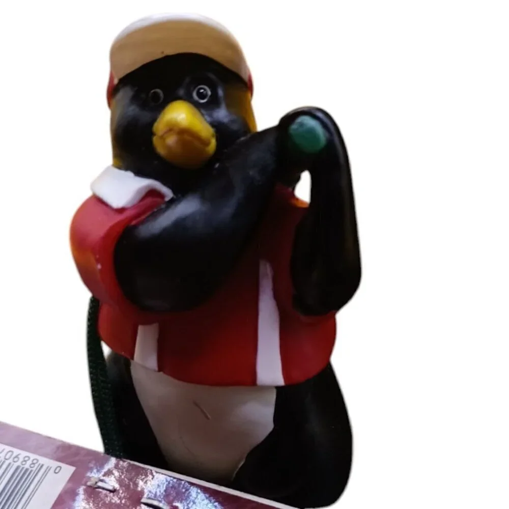 Trim a traditional golfing penguin christmas ornament